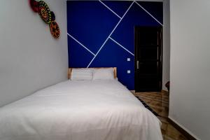 Letto o letti in una camera di Tigmi Ossmon Hostel
