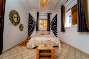 Letto o letti in una camera di Tigmi Ossmon Hostel