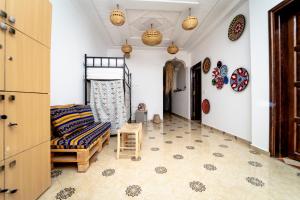 Postel nebo postele na pokoji v ubytování Tigmi Ossmon Hostel + 37 fotografií