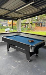 a pool table sitting under a pavilion at Think Koh Tao in Ko Tao