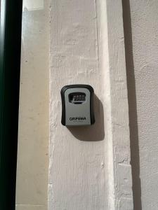 a scale sitting on the side of a bed at Loft Deluxe Clary in Bari