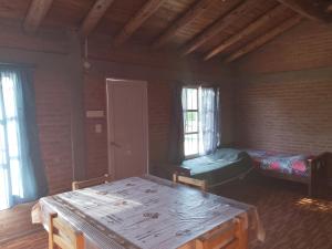 Postel nebo postele na pokoji v ubytování Cabaña las chinitas