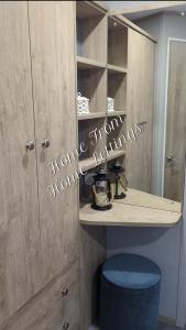 a wooden cabinet with a sign written on it at Home from Home Lettings at Tattershall Lakes - Bull Rush in Tattershall +17 photos