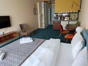TV a/nebo společenská místnost v ubytování New Gudauri Atrium 211