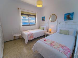 Ένα ή περισσότερα κρεβάτια σε δωμάτιο στο Villa GUACIMARA +31 φωτογραφίες