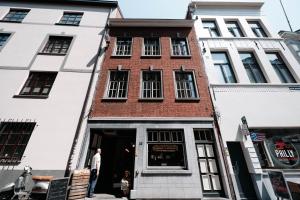 a man standing in front of a building at Cathedral View luxurious Apartment in Antwerp