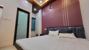 Postel nebo postele na pokoji v ubytování Hotel Mahika