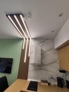 a kitchen with a light hanging from the ceiling at ST Luxury Urban Living in Serres