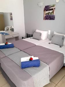 A bed or beds in a room at Stavros Villas&Apartments