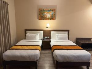Voodi või voodid majutusasutuse Hotel Shuman, Boudha toas