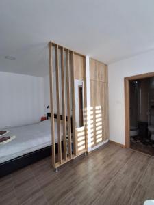 Postel nebo postele na pokoji v ubytování Studio apartman "Kutak DIVUS"