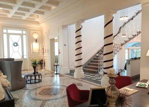 a living room with black and white columns at Dimora Palanca Boutique & SPA in Florence