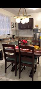 a kitchen with a table with two chairs and a table sidx sidx sidx at Fantástico con luz aire tv y cocina in La Romana
