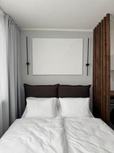 Ένα ή περισσότερα κρεβάτια σε δωμάτιο στο Modern Apartment in the City Center