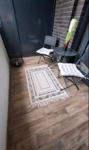 Posezení v ubytování Pupinova palata- Apartman 7 + 2 fotografie