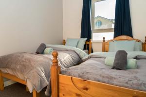 Postel nebo postele na pokoji v ubytování Glancys Accomadation