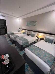 Ένα ή περισσότερα κρεβάτια σε δωμάτιο στο Open Hotel Makka +4 φωτογραφίες