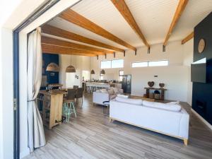 a living room with a couch and a table at 155 Hangklip self catering in Pringle Bay
