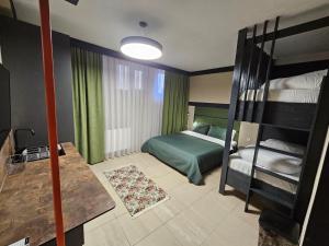 Postel nebo postele na pokoji v ubytování Hotel Kika