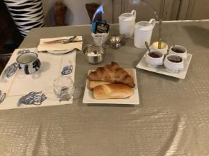 a table with two plates of food on it at Chez l habitant in Méré