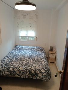 a bedroom with a bed in a room with a window at Habitación 1 Piso Particular Castilleja de la Cuesta in Castilleja de la Cuesta