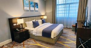 Lova arba lovos apgyvendinimo įstaigoje Sherao Hotel Doha فندق شراعوه الدوحة