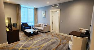 Svetainės erdvė apgyvendinimo įstaigoje Sherao Hotel Doha فندق شراعوه الدوحة