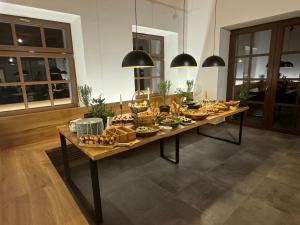 a table with food on it in a room at Wellness Apartmán Kvilda in Kvilda