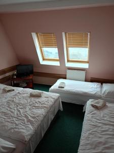 Postel nebo postele na pokoji v ubytování Motel Oseček