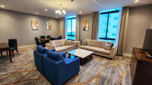Svetainės erdvė apgyvendinimo įstaigoje Sherao Hotel Doha فندق شراعوه الدوحة