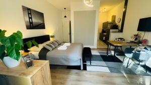 a living room with a bed and a dining room at Ferienwohnung Jurga in Pirna