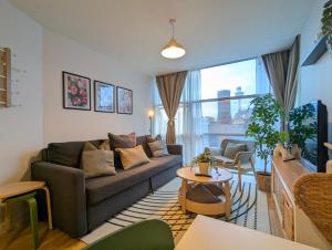 a living room with a couch and a table at City Centre Morden 1-bedroom Apt Near Dock in Liverpool