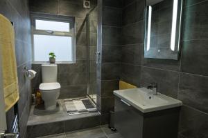 a bathroom with a toilet and a sink at The bungalow at Phoenix Court in Todmorden +22 photos