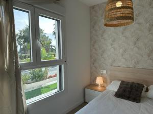 a bedroom with a bed and a window at Nasila Golf&Beach in Motril +52 photos