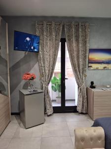 TV a/nebo společenská místnost v ubytování Matilde Valletta Suites