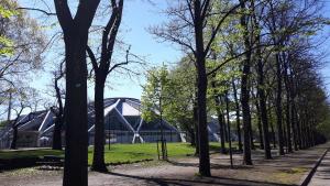 a group of trees in front of a building at Torino Cozy Lodge in Turin