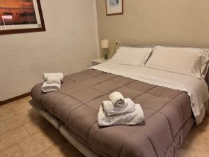 Voodi või voodid majutusasutuse Hotel Le Logge toas