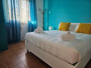 Ένα ή περισσότερα κρεβάτια σε δωμάτιο στο Il Faro Apartment