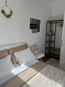 a bedroom with a bed and a sign on the wall at Lucky Star Apartments in City Center in Split