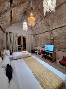 Grand Daghan Cottage 객실 침대