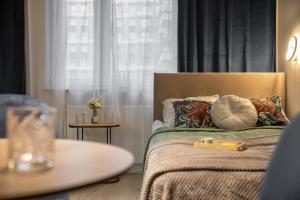 Ένα ή περισσότερα κρεβάτια σε δωμάτιο στο miniStudios Habicha by VAYA STAYS +37 φωτογραφίες
