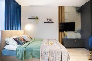 Ένα ή περισσότερα κρεβάτια σε δωμάτιο στο miniStudios Habicha by VAYA STAYS