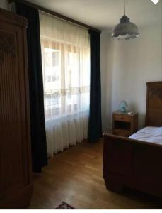 Ένα ή περισσότερα κρεβάτια σε δωμάτιο στο Du vert au cœur de la vallée de la fensch