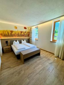 Ένα ή περισσότερα κρεβάτια σε δωμάτιο στο Agriturismo Mas Dei Preti