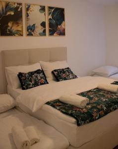 a bed with two pillows on top of it at Apartman Marija Medjugorje in Međugorje