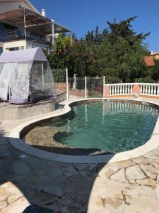 a pool with a gazebo next to a house at Villa Elisabeth Saint-Raphaël in Saint-Raphaël +38 photos