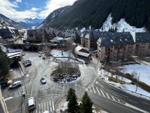 an aerial view of a city with a snow covered mountain at Baqueira1500, apartamento con vistas a pie de pistas in Naut Aran