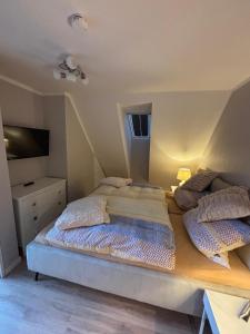 a large bed in a room with at Fewo Chill und Meer in Horumersiel