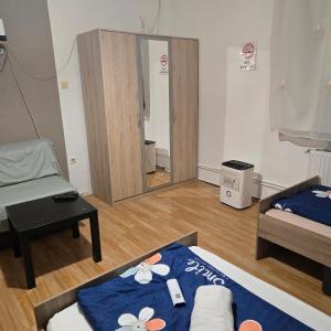 A bed or beds in a room at Orsi Apartman / vendegház