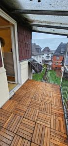 an outdoor deck with a view of a house at Ferienwohnung Alte Wache 12 DG in Holzminden +7 photos